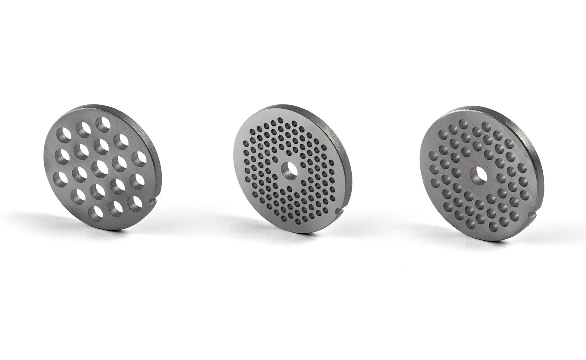 Drie metalen hakschijven.