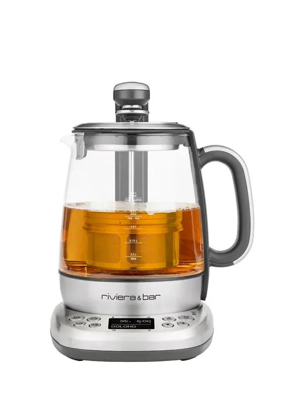 Elektrische theepot van glas en verzilverd metaal.