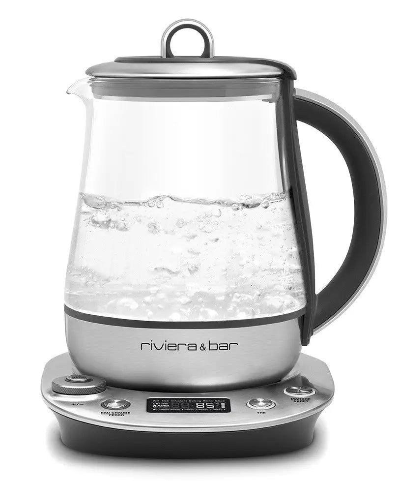 Glazen waterkoker met zilveren voet.